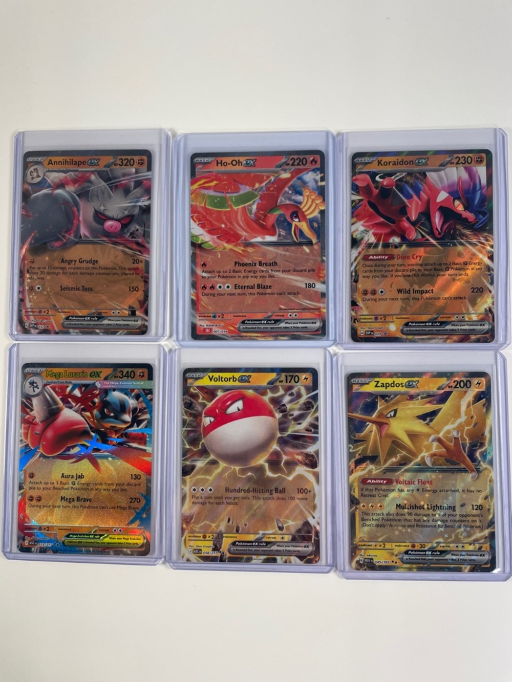 Pokémon EX Lot - Annihilape, Ho-Oh, Koraidon, Mega Lucario, Voltorb and Zapdos - Picture 1 of 8